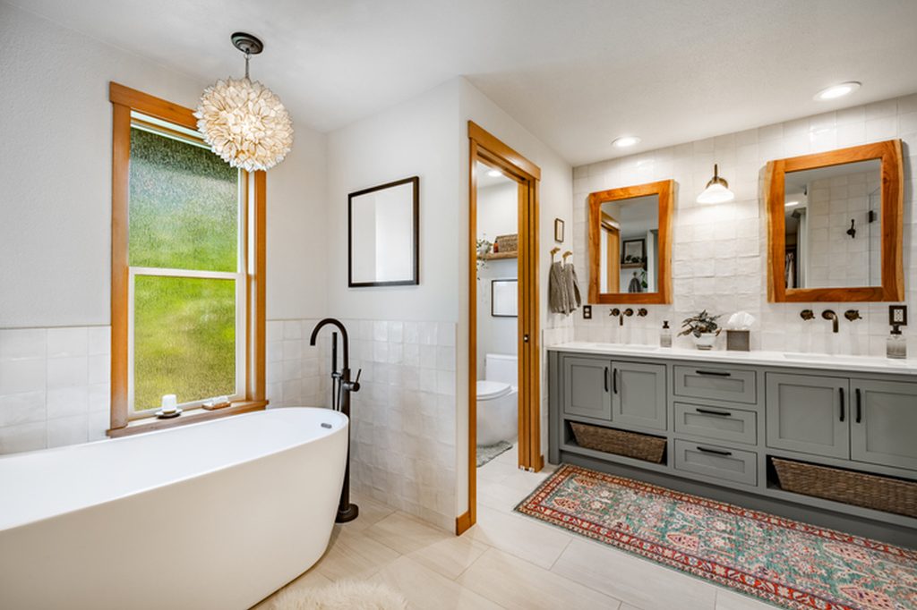 Tiled bathroom floor and wainscot in a Boise bathroom remodel