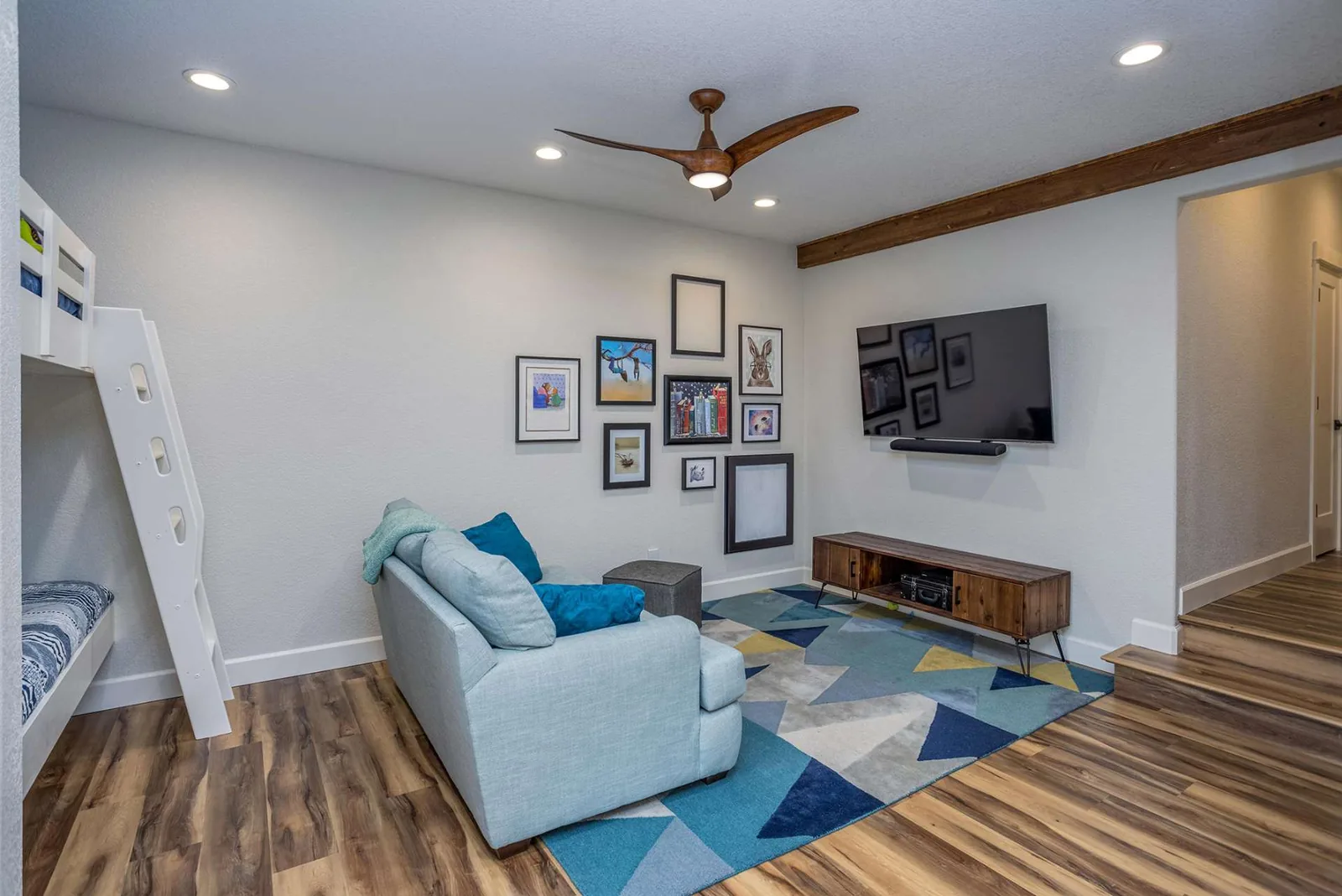 Finished family room with an exposed wood beam in a Treasure Valley home remodeled by Jones Quality Remodeling